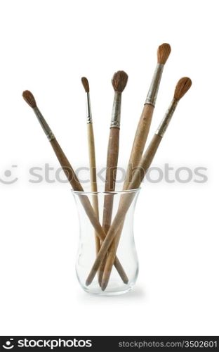 brushes in a glass isolated on white background
