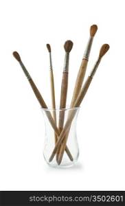 brushes in a glass isolated on white background