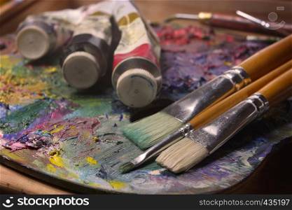 brushes, paints and pallette