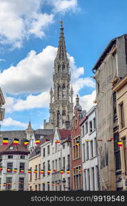 Brussels, Belgium - July 20, 2020  Tower of the city hall at the Grand place central square in the old town of Brussels