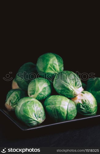 Brussels sprouts on black background