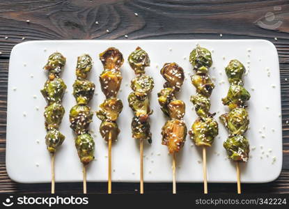 Brussels sprouts skewers with teriyaki sauce