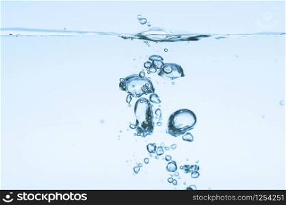 Bubbles in blue water White background