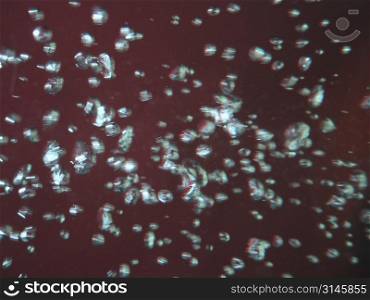 bubbles in water, red background, image used for graphic background.