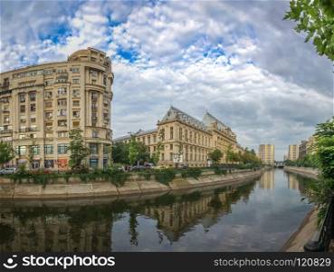 BUCHAREST, ROMANIA - 07.20.2018. Dambovita river in Bucharest in a cloudy summer day. Dambovita River in Bucharest