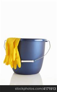 Bucket and rubber gloves