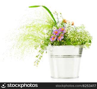 Bucket of spring fresh wild flowers isolated on white background
