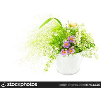 Bucket of spring fresh wild flowers isolated on white background