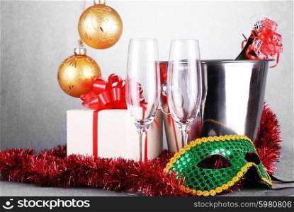 bucket with champagne bottle and green mask. christmas symbols