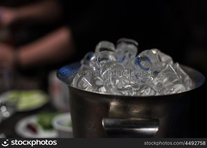 bucket with ice cubes. bucket filled with ice cubes closeup