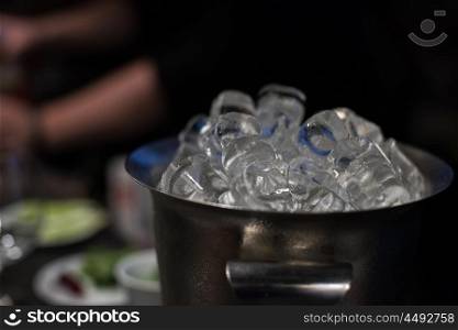 bucket with ice cubes. bucket filled with ice cubes closeup