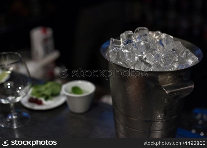 bucket with ice cubes. bucket filled with ice cubes closeup