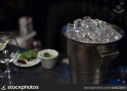 bucket with ice cubes. bucket filled with ice cubes closeup