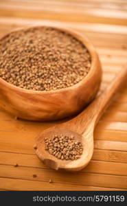 buckwheat . buckwheat at wooden plate on wooden background