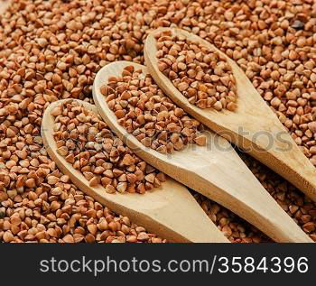 buckwheat groats and wooden spoon