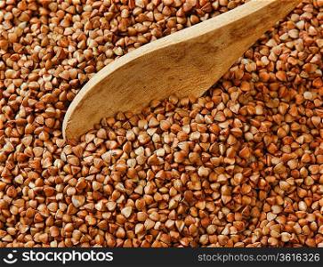 buckwheat groats and wooden spoon