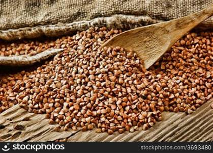 buckwheat groats and wooden spoon