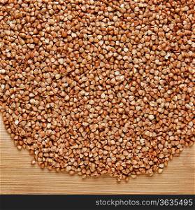 buckwheat groats on a wooden table