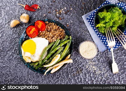 Buckwheat porridge with boiled eggs, vegetables and broccoli