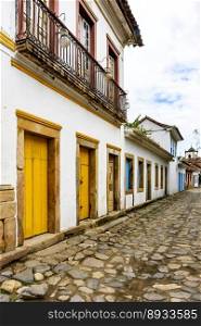 Bucolic street in the historic city of Paraty in the state of Rio de Janeiro with cobblestone pavement and colonial style houses. Bucolic street in the historic city of Paraty 