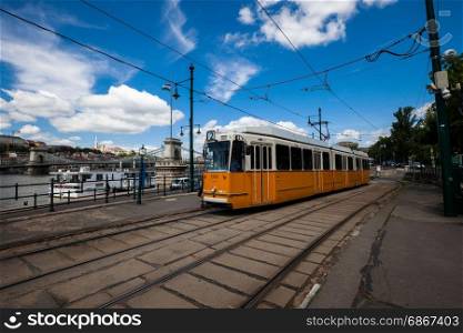 BUDAPEST, HUNGARY - MAY 8, 2017: Yellow tram running at old city center of Budapest