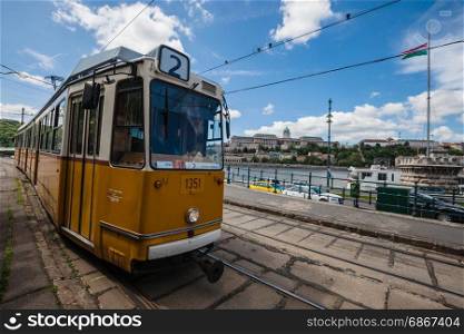 BUDAPEST, HUNGARY - MAY 8, 2017: Yellow tram running at old city center of Budapest.