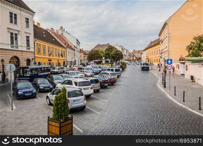Budapest, Hungary - September 16, 2015: Street in the buda hill next to buda castle in Budapest, Hungary. Parked cars, buses and unidentified people.
