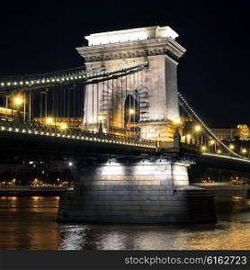 Budapest, Hungary. Szechenyi Chain Bridge on the Danube river at night
