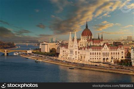 Budapest parliament building landscape panorama in sunset view with river Danube an capital of Hungary. Budapest parliament building in sunset view with river Danube an capital of Hungary