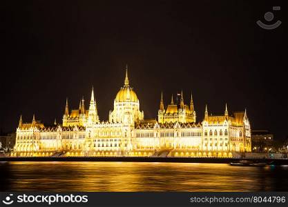 Budapest Parliament on Danube riverside by night