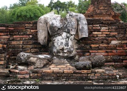 Buddha and brick wall in Sukhotai, Thailand