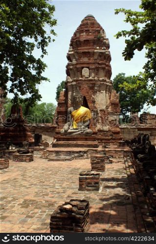 Buddha and pagoda in wat Mahathat in Ayuthaya, Thailand