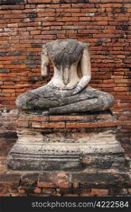 Buddha and red brick all in wat Chai Wattanaram in Ayuthaya, Thailand