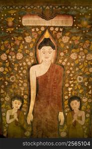 Buddha and two disciples on old temple cotton scroll from Thailand.