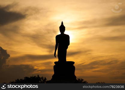 Buddha at sunset. When the evening sun is bright red. Lord Black is a sleek backlit.