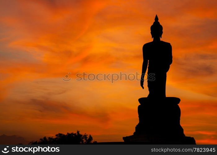 Buddha at sunset. When the evening sun is bright red. Lord Black is a sleek backlit.