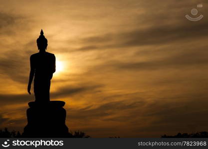 Buddha at sunset. When the evening sun is bright red. Lord Black is a sleek backlit.