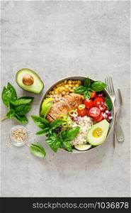 Buddha bowl with grilled chicken breast, tomato, onion, corn, avocado, fresh basil salad and rice, healthy balanced eating for lunch