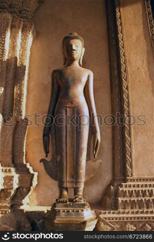 Buddha near wall in wat Phra Keo, Vientiane