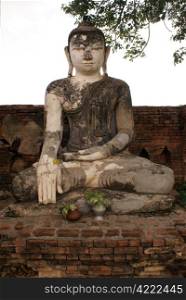 Buddha on the brick wall in Inwa, Mandalay, Myanmar