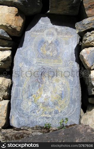 Buddha on the stone shrine in Nepal