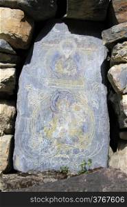 Buddha on the stone shrine in Nepal