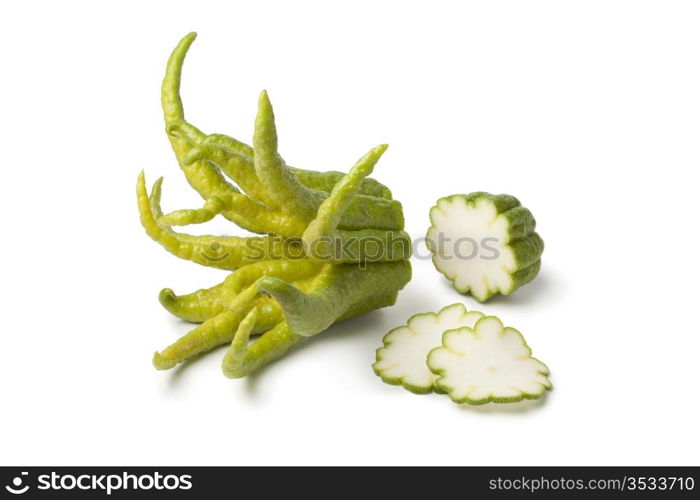 Buddha&rsquo;s hand fruit with slices on white background