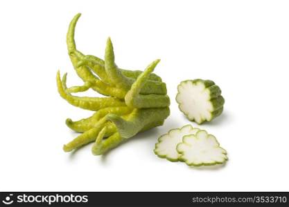 Buddha&rsquo;s hand fruit with slices on white background