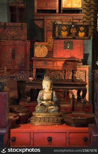 Buddha statue in antique store.