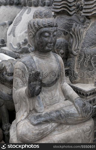 Buddha statue in Panjiayuan antique market, Beijing, China