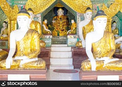 Buddha statues inside the Shwedagon Pagoda in Myanmar