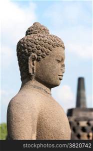 Buddha with stufa detail at Borobudur temple, Yogyakarta, Indonesia