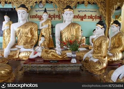Buddhas in temple, Shwe Dagon paya, Yangon, Myanmar