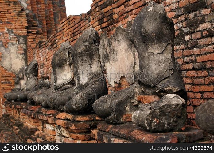 Buddhas near wall in wat Chai Wattanaram, Ayuthaya, Thailand